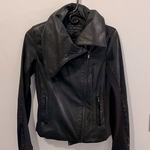 Black leather jacket from Lamarque. Asymmetrical zip and collar.